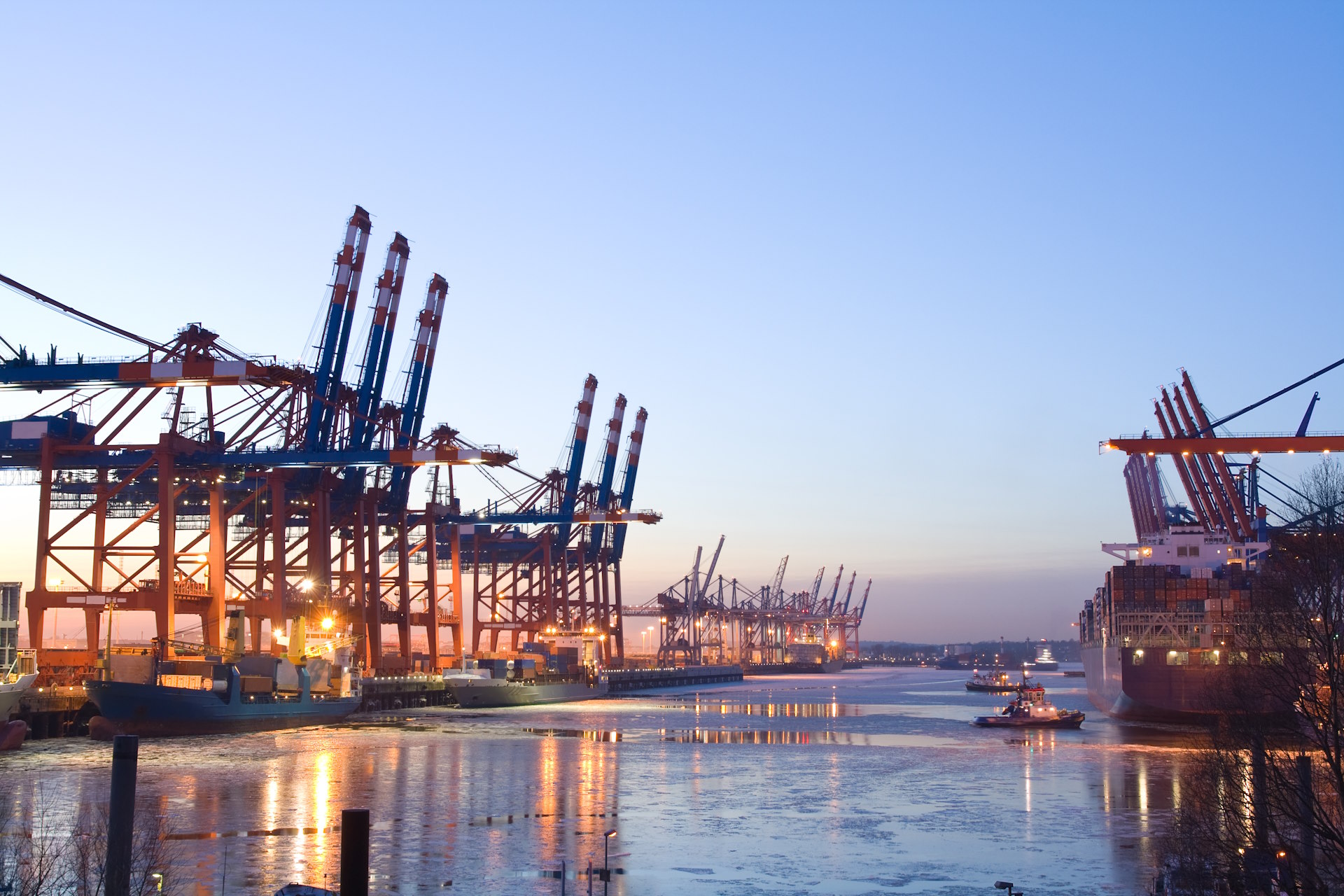 Cargo ships in the industrial harbor district in Hamburg, Germany.